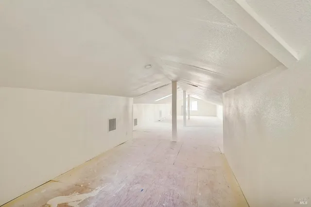 a view of roof deck with patio