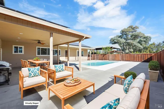 a outdoor living space with furniture and garden view