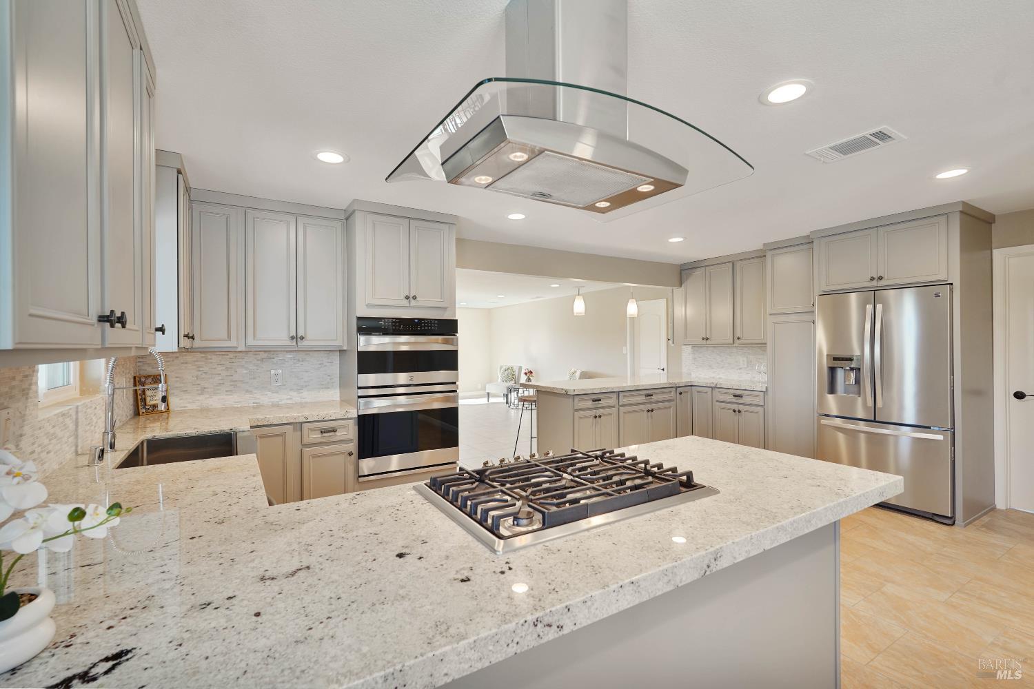 7208 Browns Valley Road Vacaville, CA 95688 - Photo 9 of 64 a kitchen with stainless steel appliances granite countertop a sink a stove a refrigerator and cabinets