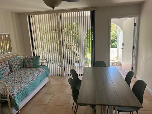 425 Grapetree Drive, Unit 209 Key Biscayne, FL 33149 - Photo 2 of 6 a living room with furniture and a large window