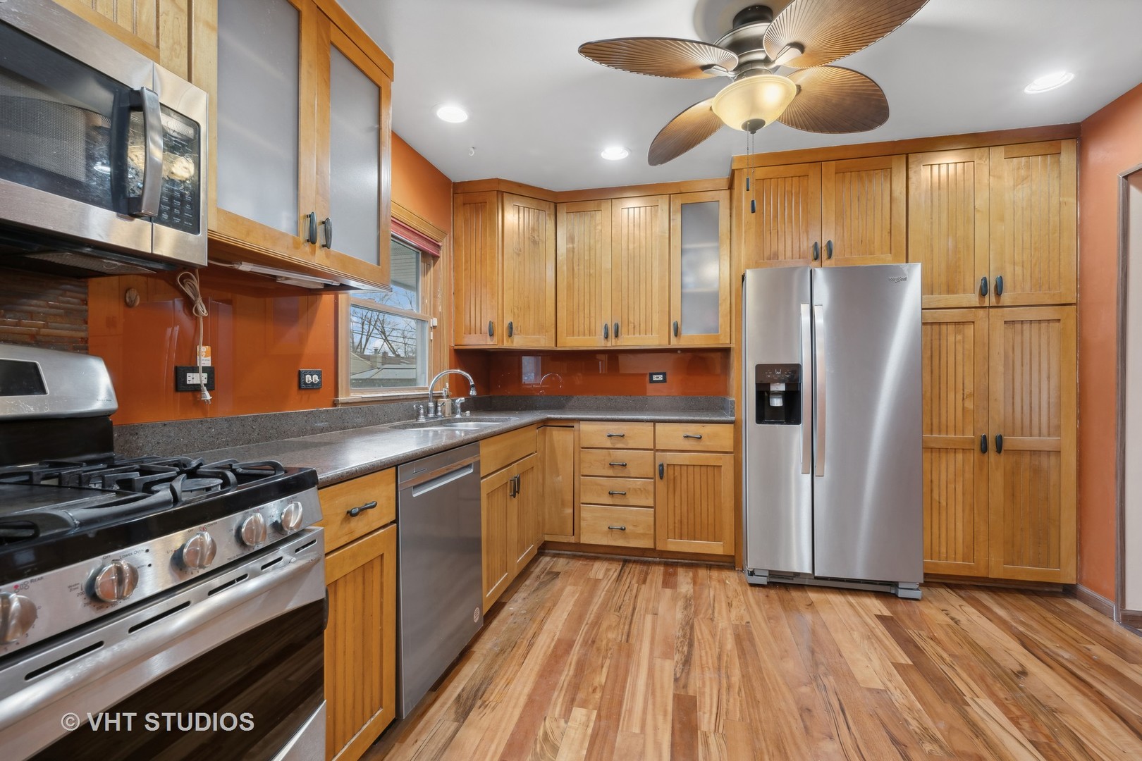 638 Sycamore Road Buffalo Grove, IL 60089 - Photo 8 of 18 a kitchen with stainless steel appliances granite countertop a refrigerator and a stove top oven