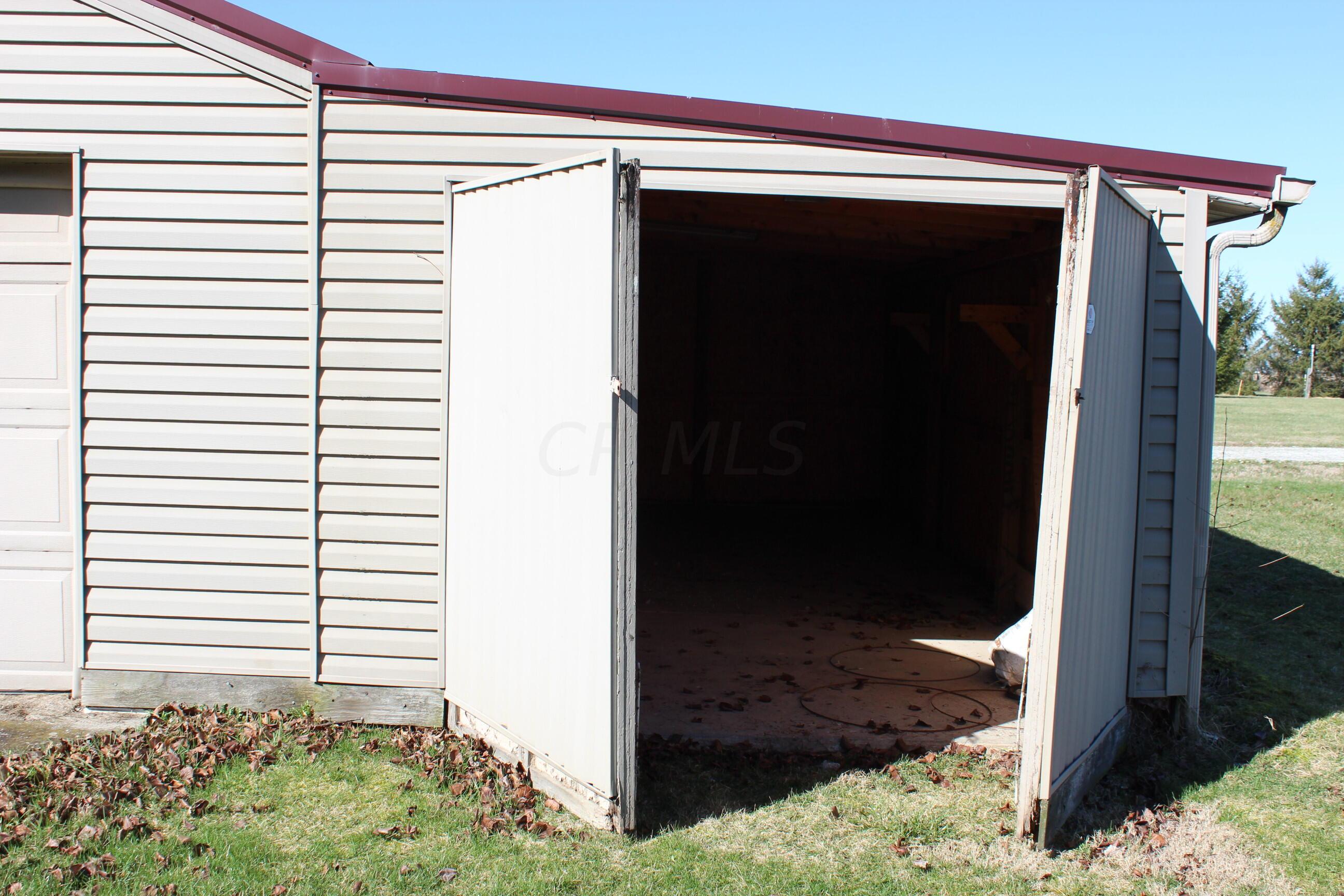 540 Newmans-Cardington Road West Prospect, OH 43342 - Photo 11 of 41 Storage room on one stall garage with concrete floor and electric.