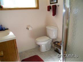 310 Cold Spring Road Burnsville, NC 28714 - Photo 15 of 17 a bathroom with a toilet and a shower