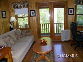 310 Cold Spring Road Burnsville, NC 28714 - Photo 6 of 17 a living room with furniture and a large window