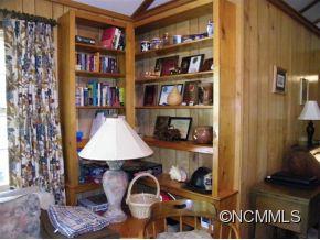310 Cold Spring Road Burnsville, NC 28714 - Photo 8 of 17 a living room with furniture and a book shelf