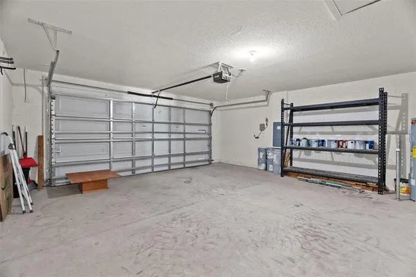 a view of a livingroom with storage and utility room