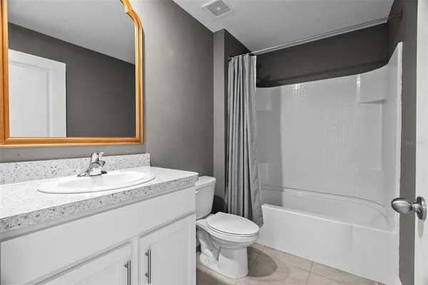 a bathroom with a sink a toilet and a bathtub
