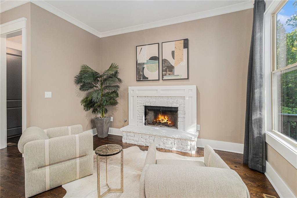 519 Holcomb Bridge Road Norcross, GA 30071 - Photo 11 of 31 a living room with furniture and a fireplace