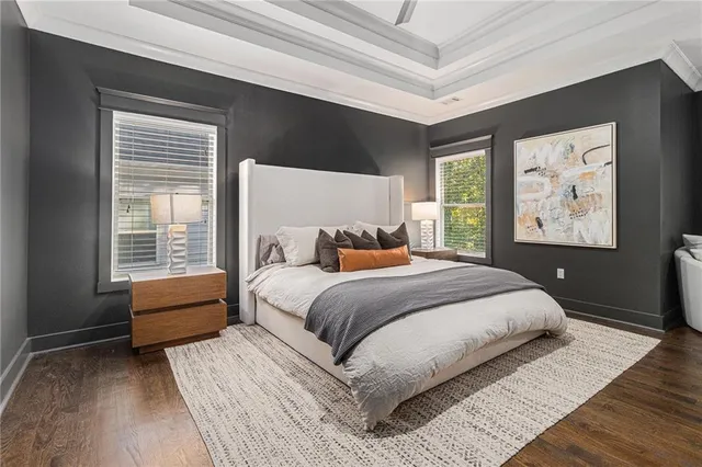 a bedroom with a large bed and a window