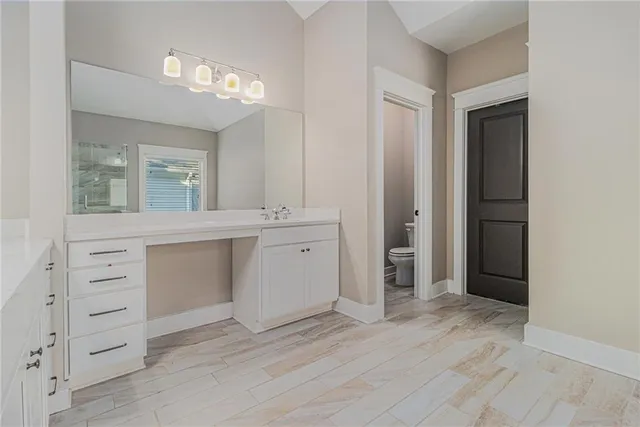 a bathroom with a double vanity sink a mirror and a shower