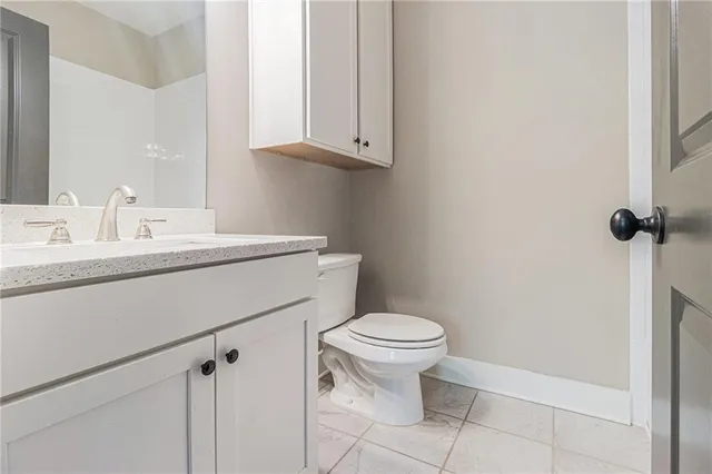 a bathroom with a sink toilet and vanity