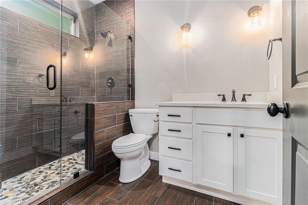 519 Holcomb Bridge Road Norcross, GA 30071 - Photo 27 of 31 a bathroom with a sink toilet and shower