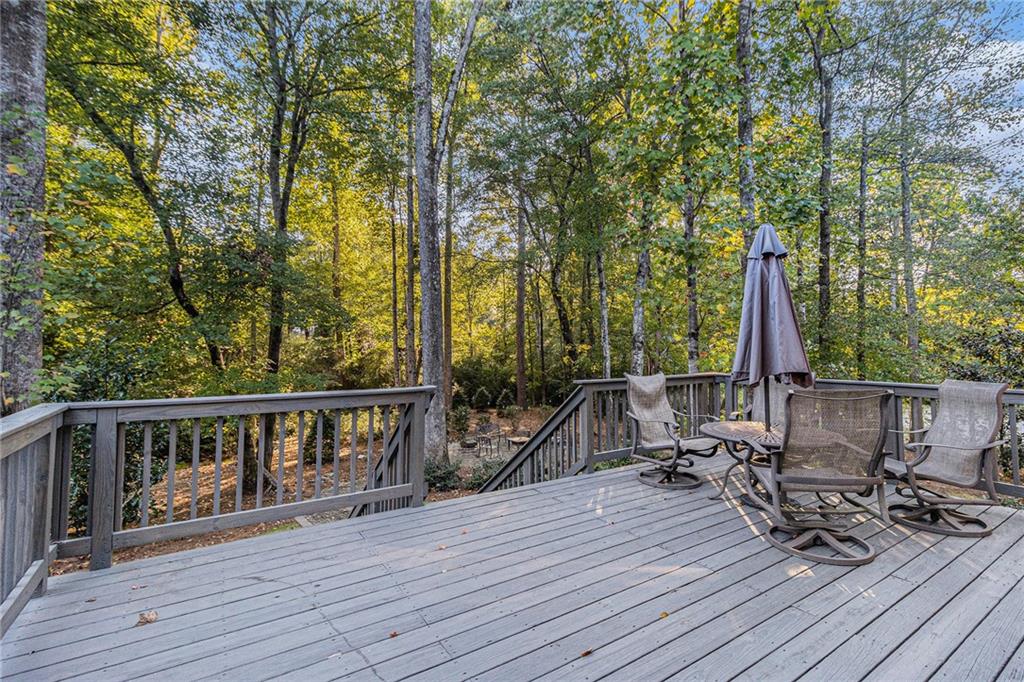 519 Holcomb Bridge Road Norcross, GA 30071 - Photo 28 of 31 a view of balcony with wooden floor and outdoor seating