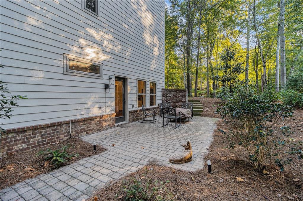 519 Holcomb Bridge Road Norcross, GA 30071 - Photo 29 of 31 a backyard of a house with outdoor seating