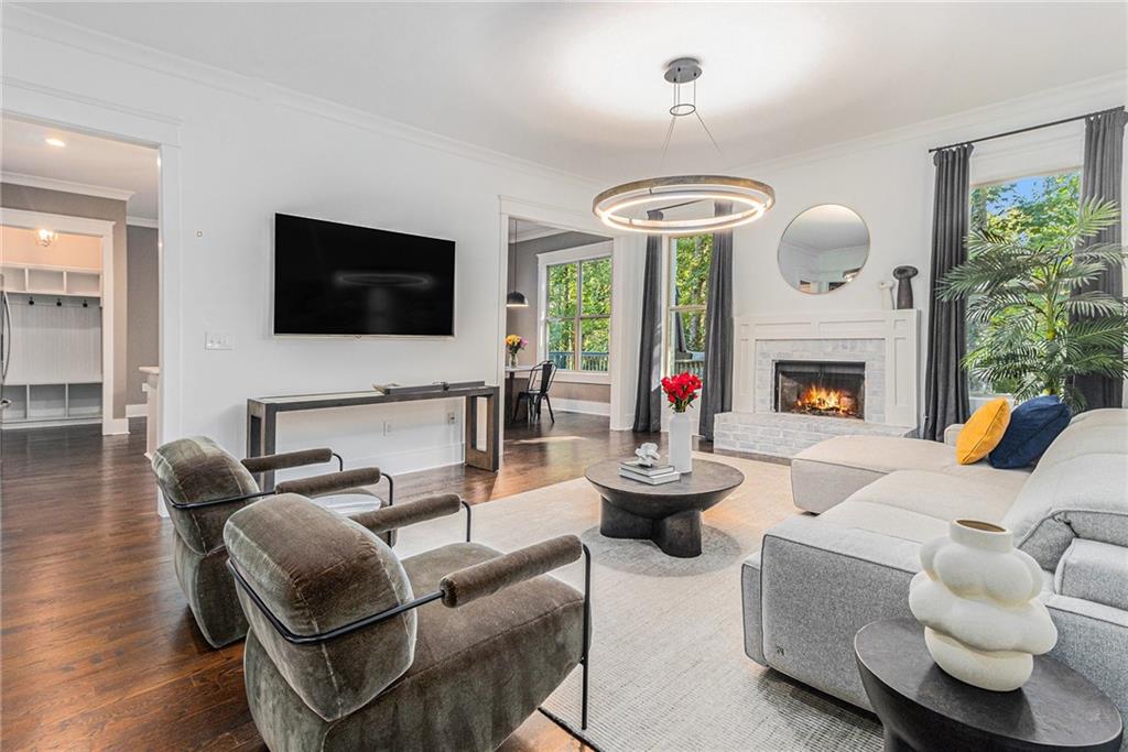 519 Holcomb Bridge Road Norcross, GA 30071 - Photo 4 of 31 a living room with furniture a fireplace and a flat screen tv