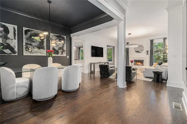 a living room with furniture large window and a flat screen tv