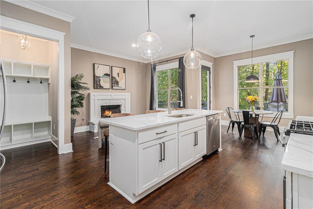 519 Holcomb Bridge Road Norcross, GA 30071 - Photo 8 of 31 a spacious kitchen with stainless steel appliances granite countertop a stove and cabinets