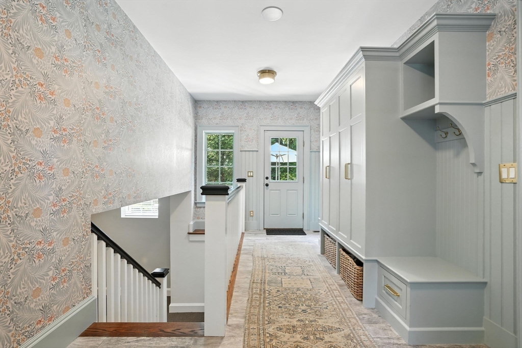15 Winthrop Road Lexington, MA 02421 - Photo 18 of 39 a view of a hallway with wooden floor and staircase