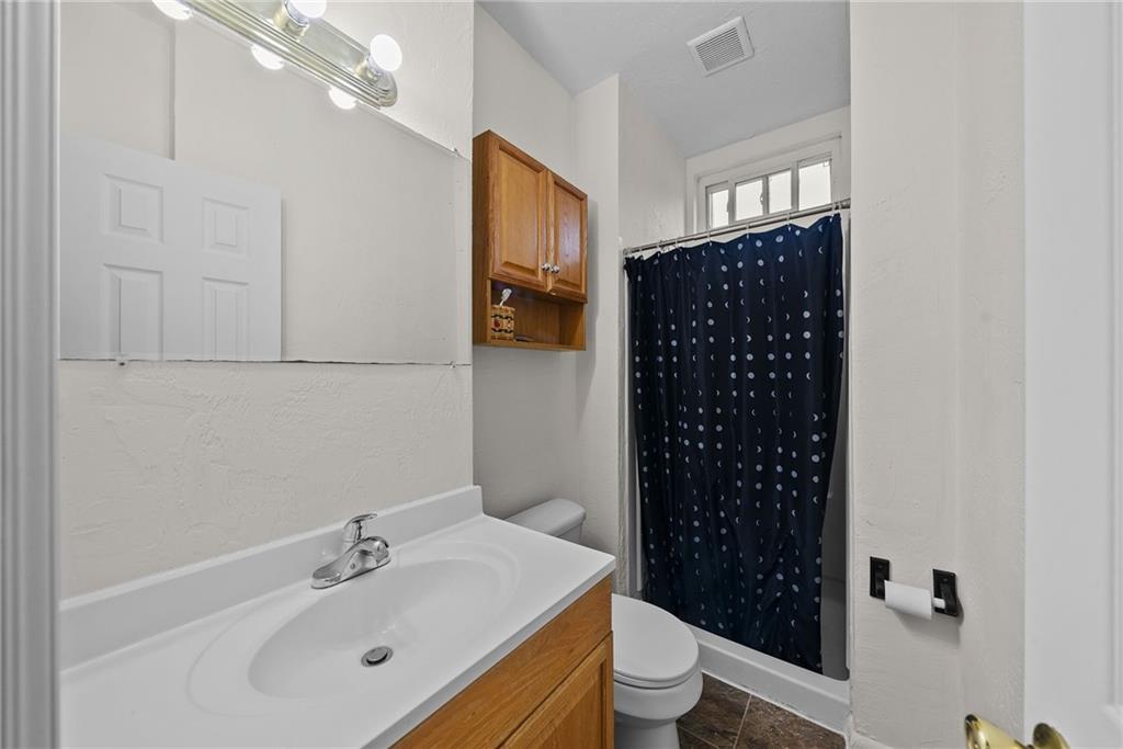 2016 Sidney Street Pittsburgh, PA 15203 - Photo 13 of 44 a bathroom with a sink toilet and shower