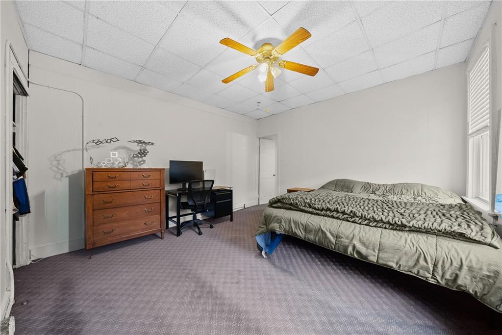 2016 Sidney Street Pittsburgh, PA 15203 - Photo 15 of 44 a bed room with a bed and a chair