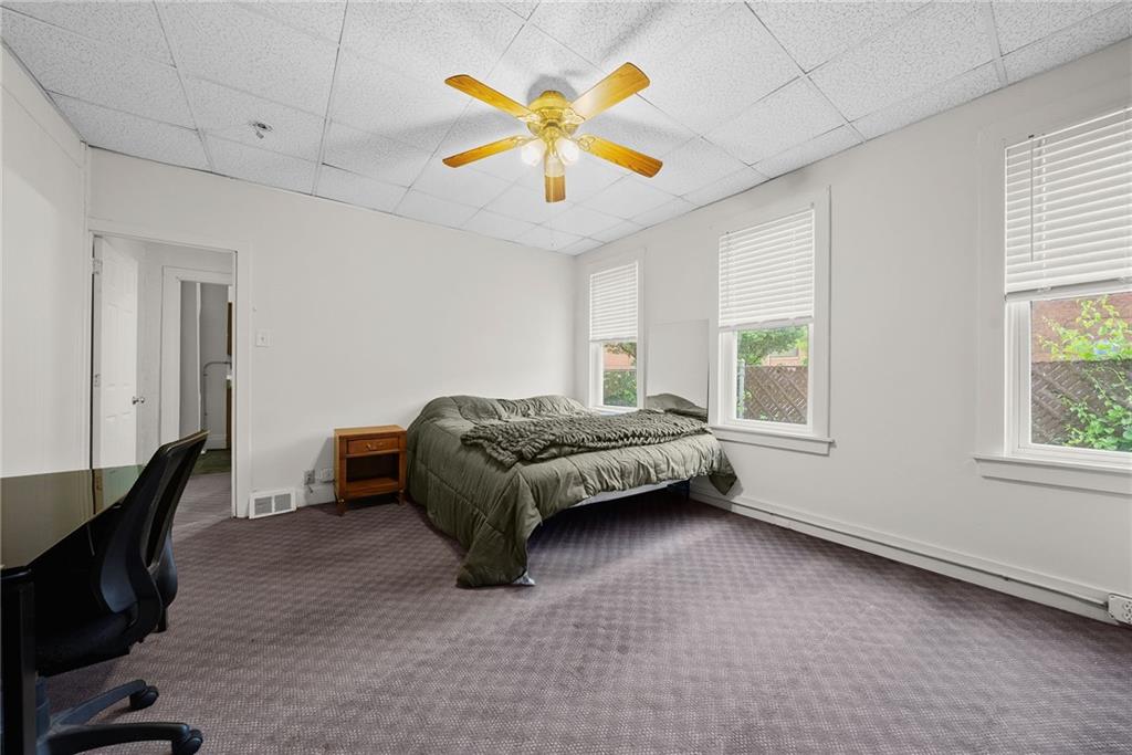 2016 Sidney Street Pittsburgh, PA 15203 - Photo 16 of 44 a bedroom with a bed and window
