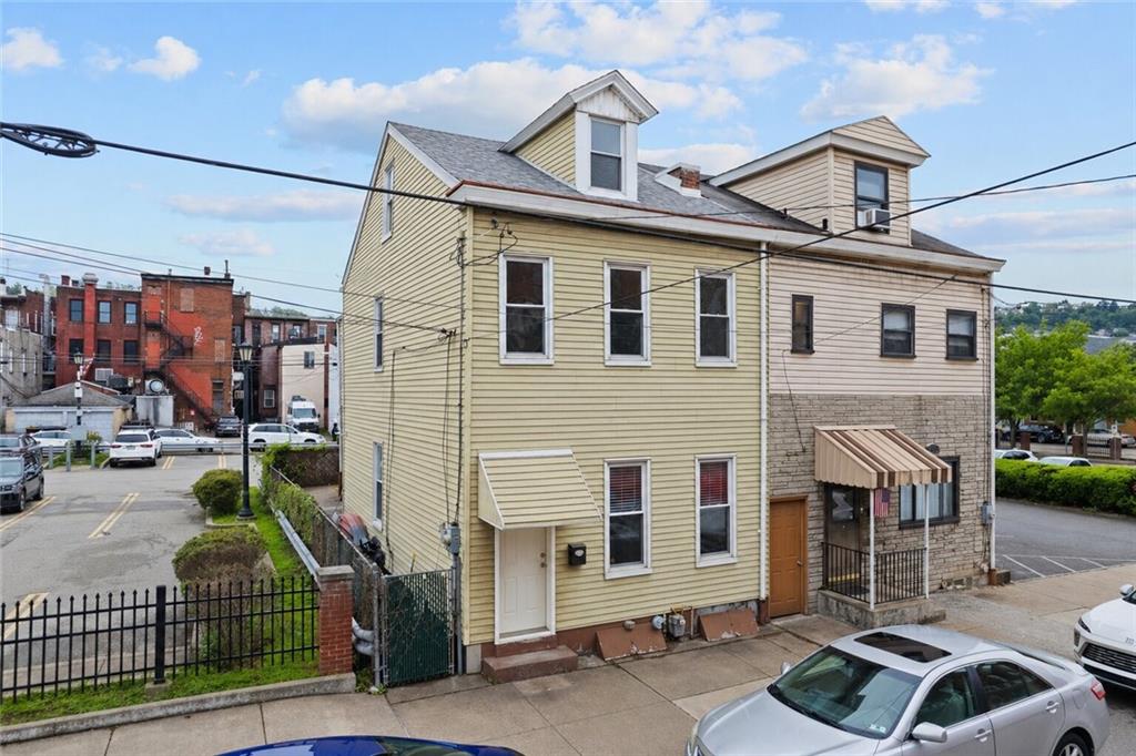 2016 Sidney Street Pittsburgh, PA 15203 - Photo 2 of 44 a front view of a house with garage