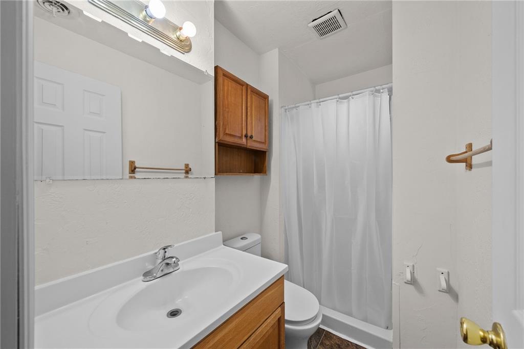 2016 Sidney Street Pittsburgh, PA 15203 - Photo 23 of 44 a bathroom with a sink a toilet and shower