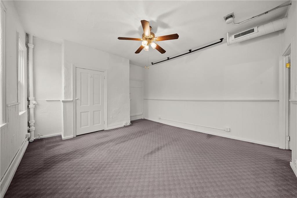 2016 Sidney Street Pittsburgh, PA 15203 - Photo 26 of 44 an empty room with wooden floor ceiling fan