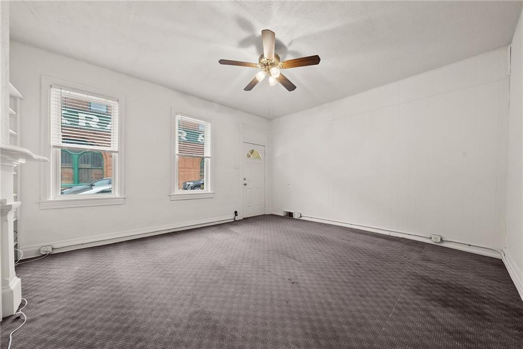 2016 Sidney Street Pittsburgh, PA 15203 - Photo 5 of 44 an empty room with windows and ceiling fan