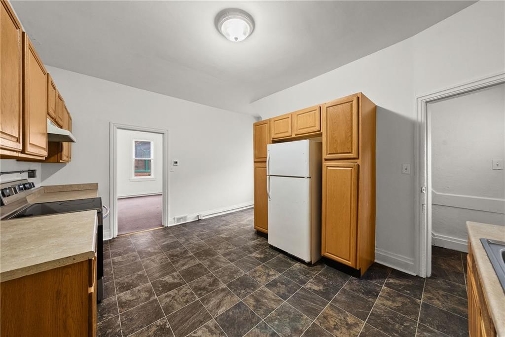 2016 Sidney Street Pittsburgh, PA 15203 - Photo 10 of 44 a view of a kitchen with refrigerator and cabinet