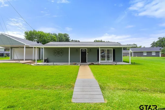 a view of a house with a garden
