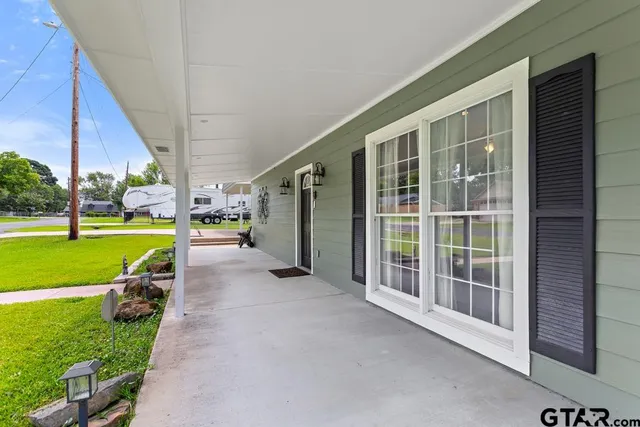 a view of a garden with an outdoor seating