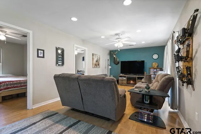 a living room with furniture and a flat screen tv