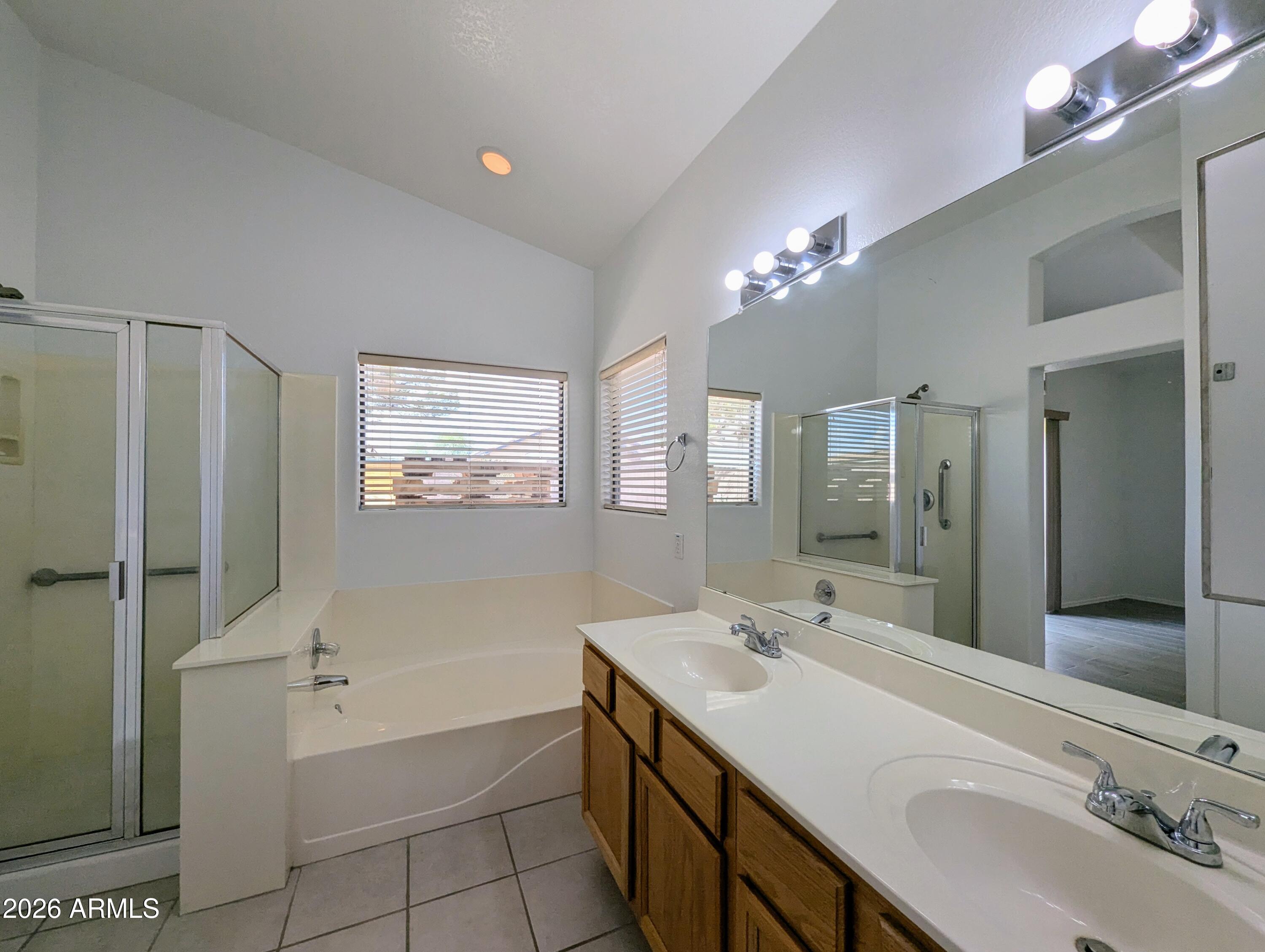 5424 West Wagoner Road Glendale, AZ 85308 - Photo 20 of 37 a bathroom with a tub sink double and mirror