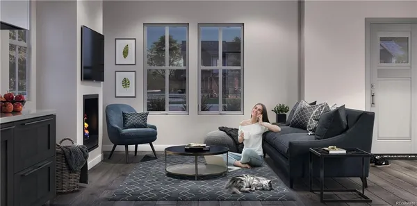 a living room with furniture rug and window