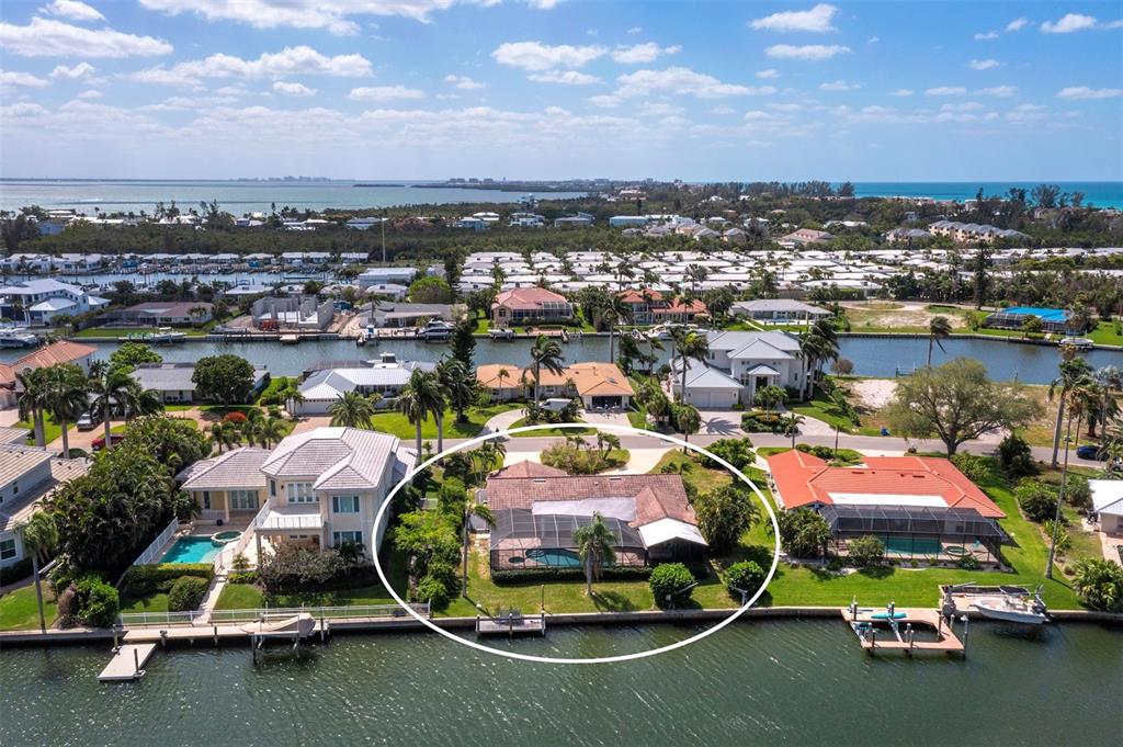 741 Old Compass Road Longboat Key, FL 34228 - Photo 45 of 57 an aerial view of a swimming pool with outdoor seating and yard