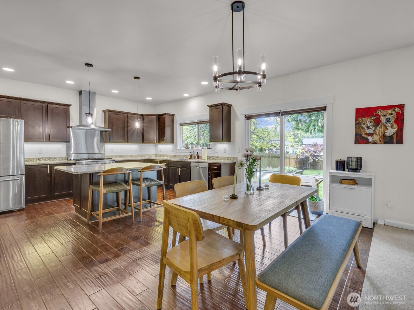 12503 Southeast 104th Street Renton, WA 98056 - Photo 11 of 37 a view of a dining room with furniture window and wooden floor