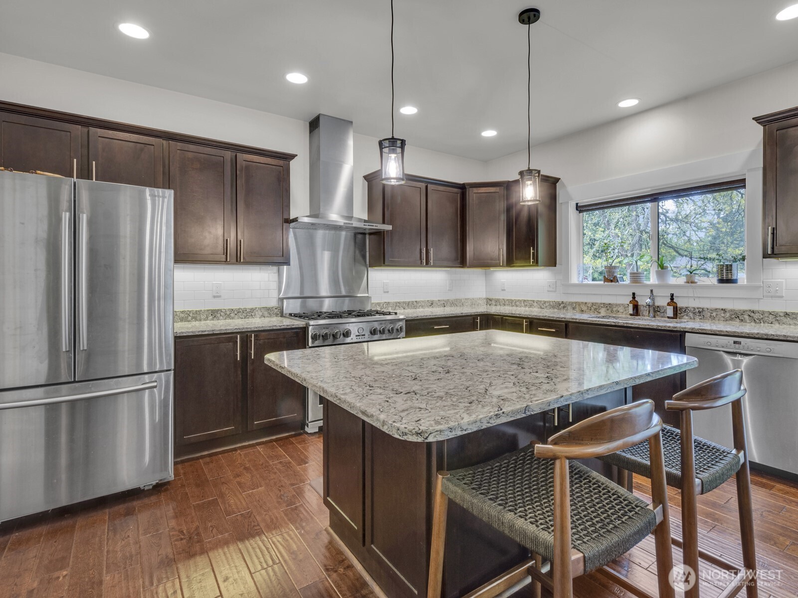 12503 Southeast 104th Street Renton, WA 98056 - Photo 15 of 37 a kitchen with kitchen island a counter space a sink appliances and cabinets