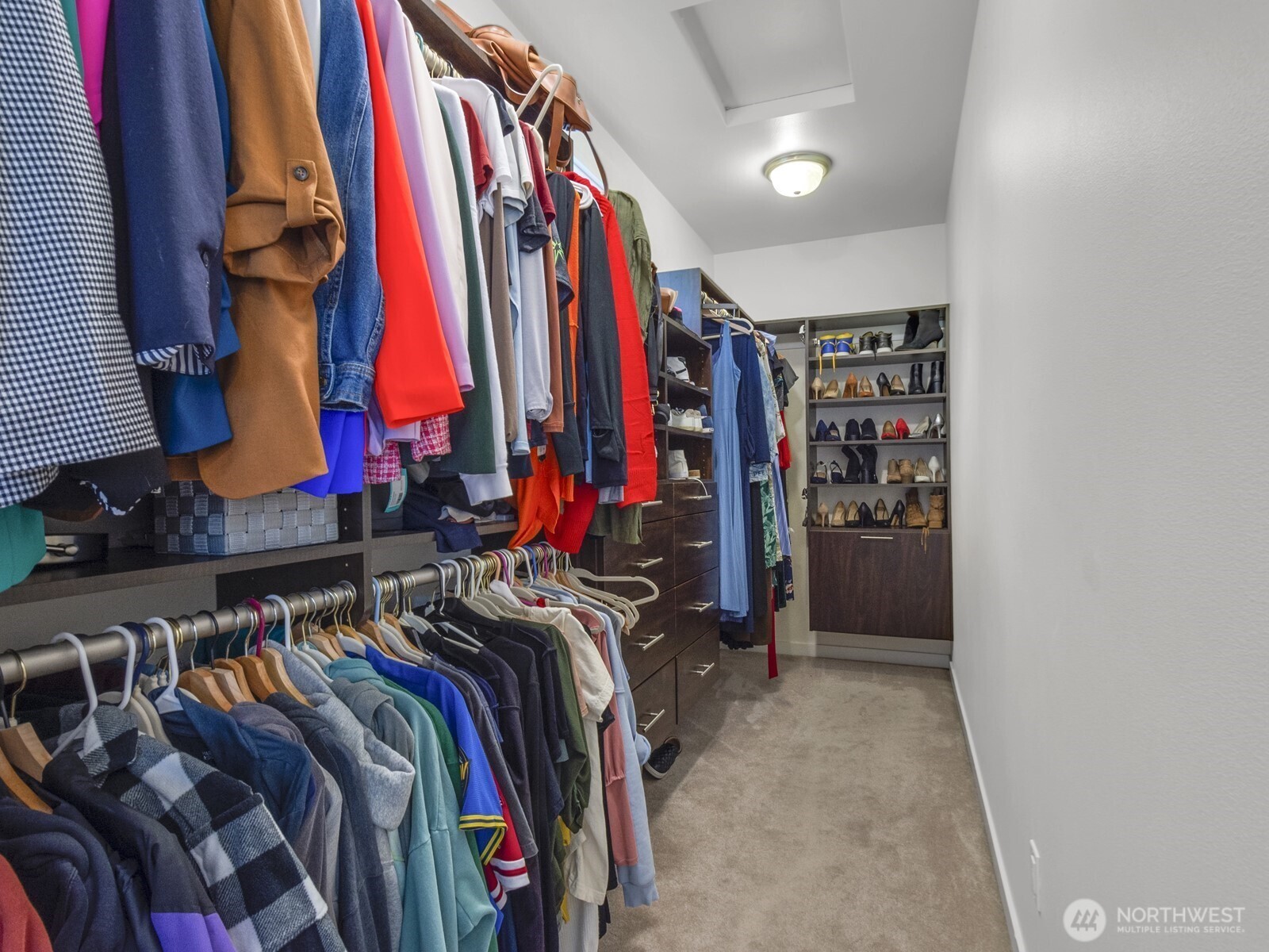 12503 Southeast 104th Street Renton, WA 98056 - Photo 23 of 37 a view of walk in closet with clothes