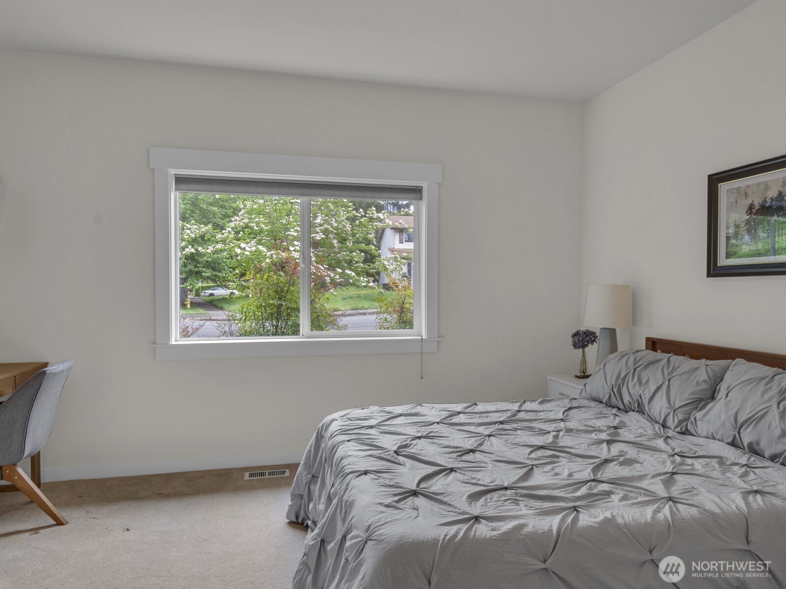 12503 Southeast 104th Street Renton, WA 98056 - Photo 24 of 37 a bedroom with a bed and a window