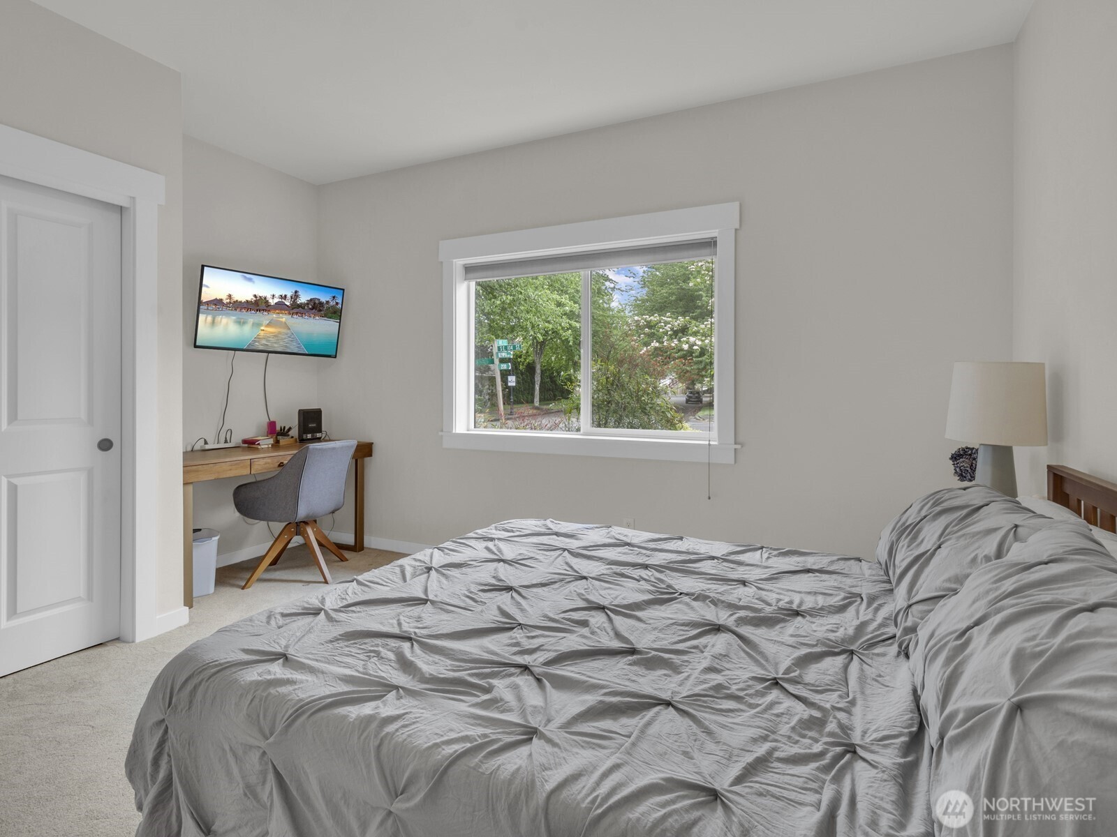 12503 Southeast 104th Street Renton, WA 98056 - Photo 25 of 37 a bedroom that has a bed and a chair in it