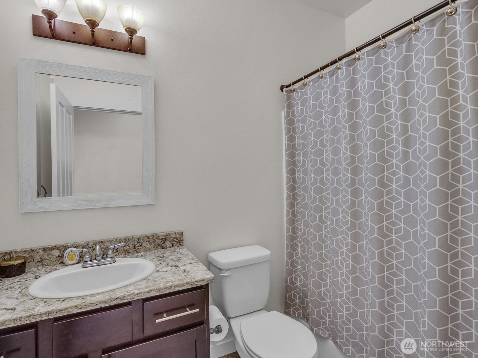12503 Southeast 104th Street Renton, WA 98056 - Photo 27 of 37 a bathroom with a granite countertop sink and a toilet