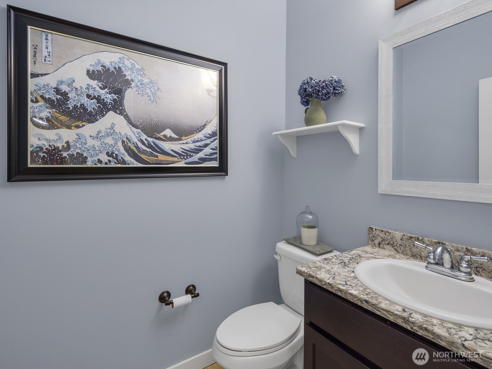 12503 Southeast 104th Street Renton, WA 98056 - Photo 29 of 37 a bathroom with a granite countertop toilet a sink and mirror