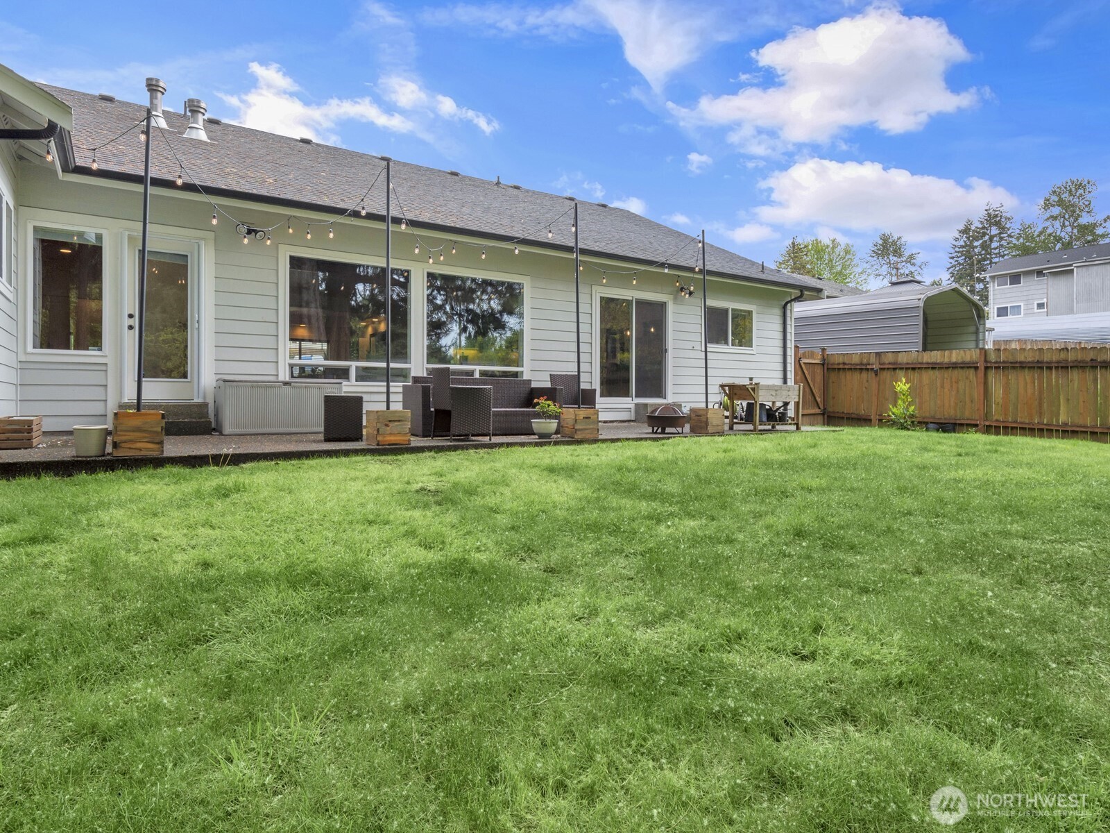 12503 Southeast 104th Street Renton, WA 98056 - Photo 32 of 37 a house view with a sitting space and garden