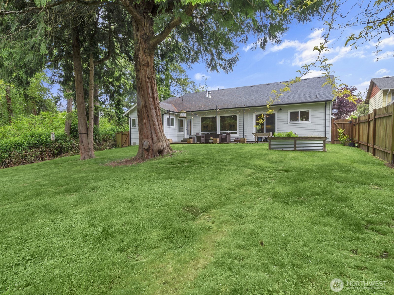 12503 Southeast 104th Street Renton, WA 98056 - Photo 33 of 37 a front view of a house with a garden