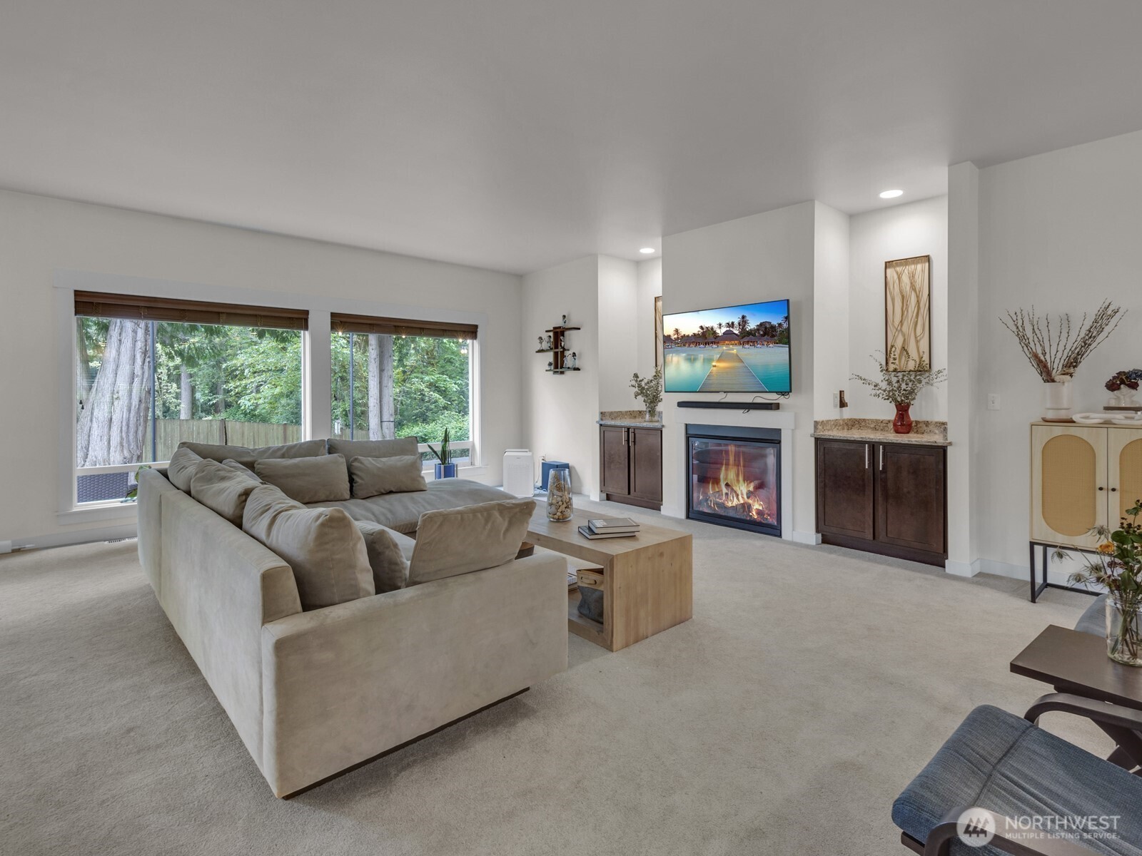 12503 Southeast 104th Street Renton, WA 98056 - Photo 6 of 37 a living room with furniture a fireplace and a flat screen tv