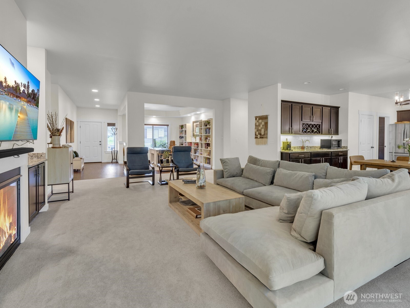 12503 Southeast 104th Street Renton, WA 98056 - Photo 8 of 37 a living room with furniture and a flat screen tv