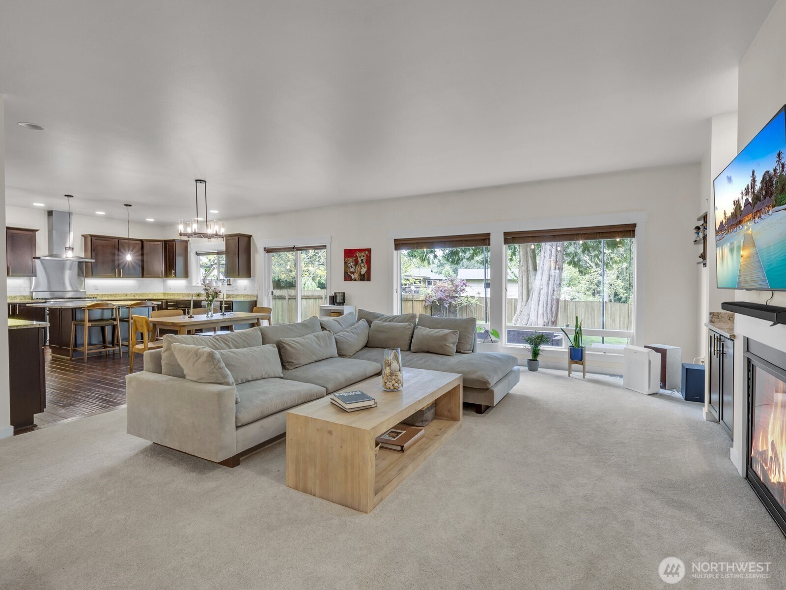 12503 Southeast 104th Street Renton, WA 98056 - Photo 9 of 37 a living room with furniture and a flat screen tv