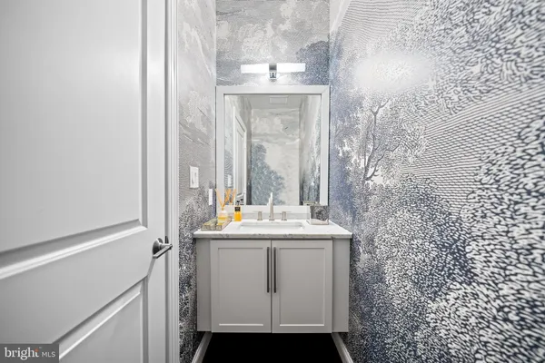 a bathroom with a bathtub and a sink