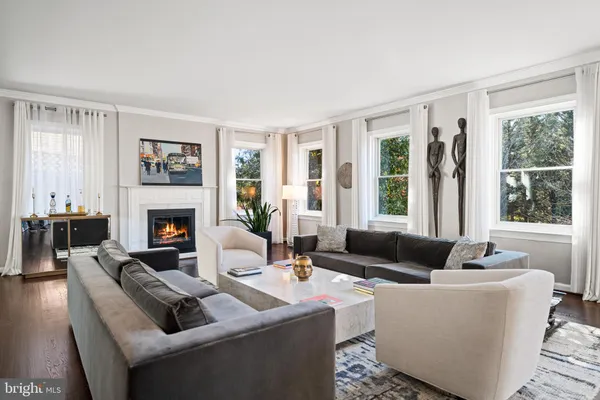 a view of a dining room with furniture wooden floor and chandelier